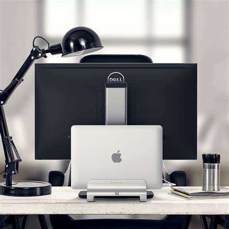 satechis vertical laptop stand solution   cluttered desk