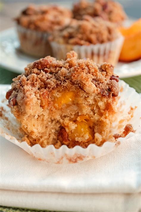 moist  delicious peach muffins  crumb topping