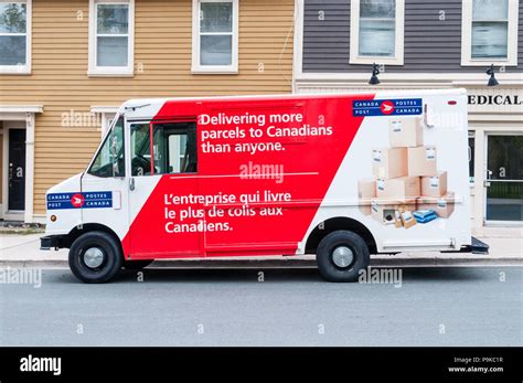 canada post  postes canada postal delivery van  bilingual english  french advertising