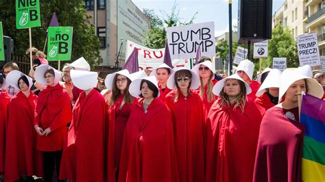 polish ‘handmaid s tale protesters welcome ‘dumb trump to their country
