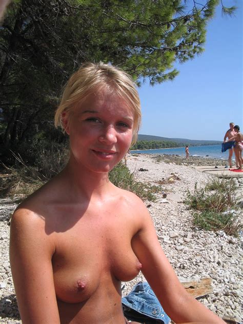 sweet russian blonde with amazing body posing topless on public beach russian sexy girls