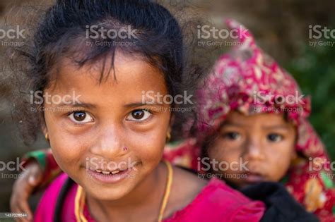 nepali girls holding her little brother village near annapurna range