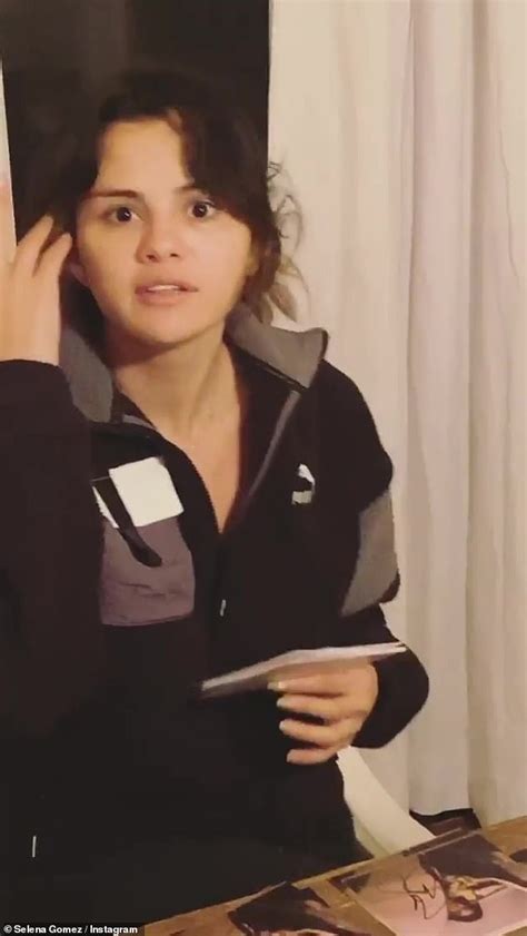 Selena Gomez Sits Clothed In A Bath As She Continues To Promote Her New