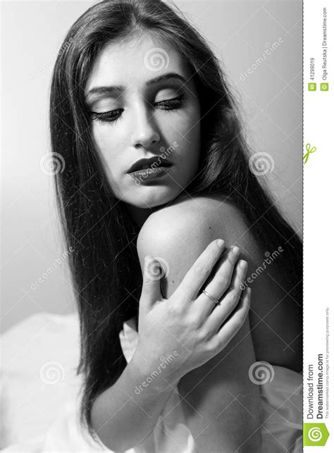 Portrait Of Seductive Woman Touching Her Naked Shoulder