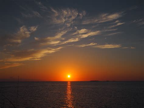 sunset   ocean waters  clouds   bahamas image