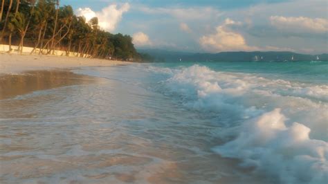 turquoise ocean waves roll   sandy beach stock footage sbv  storyblocks