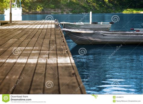 aluminum fishing boats  wood dock stock image image