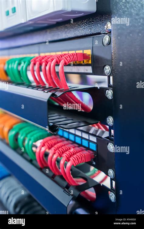 server rack  internet patch cord cables connected  patch panel  server room stock photo