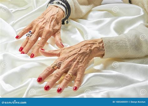 senior manicured hands  jewelry  silk stock image image