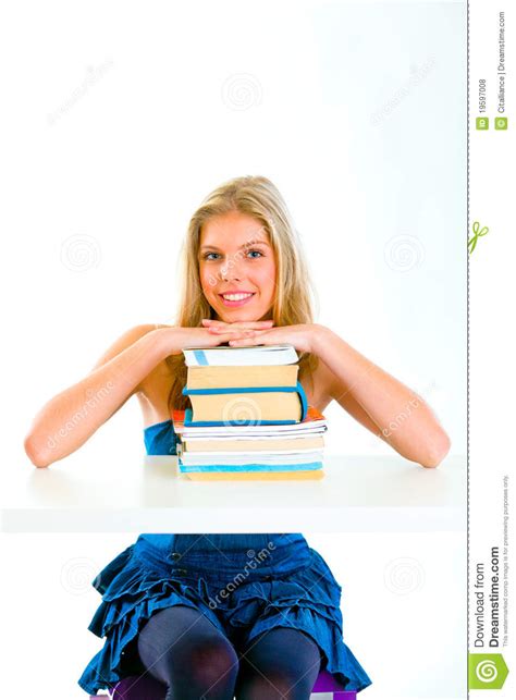 Smiling Teen Girl Holding Hands On Piles Of Books Stock