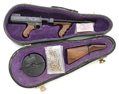 sold price miniature model  thompson machine gun  violin case