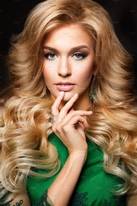 portrait  elegant sexy blonde woman  long curly hair  glamour