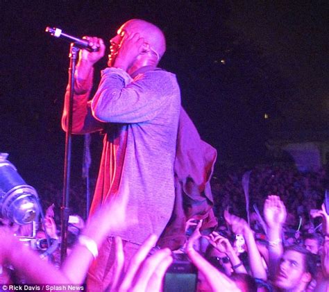 kanye west rocks out on stage in new york¿ while pregnant kim kardashian entertains herself at