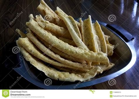 photo   close  click  salty indian snacks called  papda aka papdi   gram flour