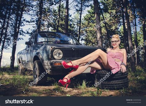 Sexy Pin Up Girl In Short Dress Sitting And Teasing Next