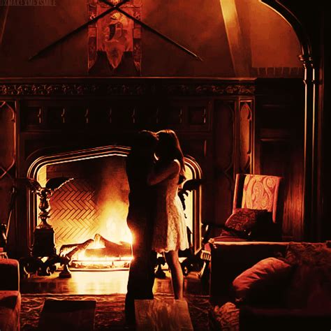 delena dancing by the fireplace