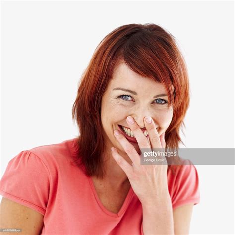 Portrait Of A Woman Laughing With Her Hand Over Her Mouth Photo Getty