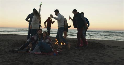 friends dancing at bonfire beach party stock footage sbv 321183636