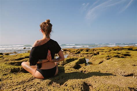 Beautiful Tattooed Woman Doing Yoga On The Beach In Summer Del