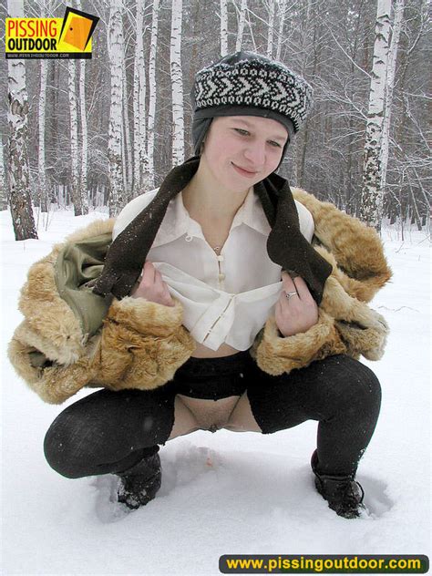 cute white teen in fur coat shirt and pantyhose takes an piss in the snow picture 13