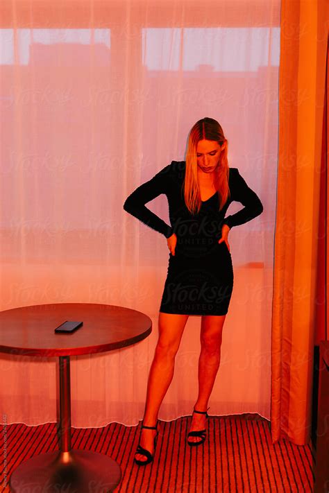 transgender woman in black dress indoors by alexey kuzma transgender