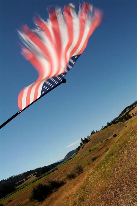 american flag blowing   wind photograph  robb kendrick fine