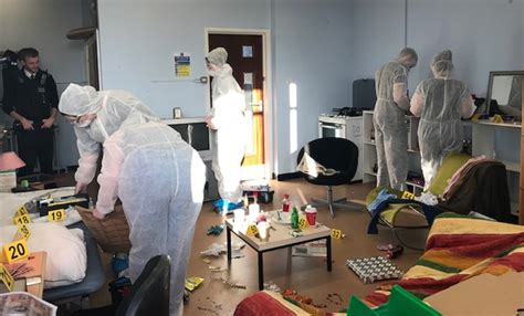 police assist forensic science students investigate  mock crime scene