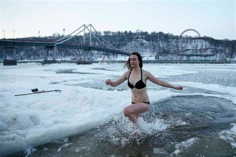 russian orthodox believers take icy plunge to celebrate epiphany