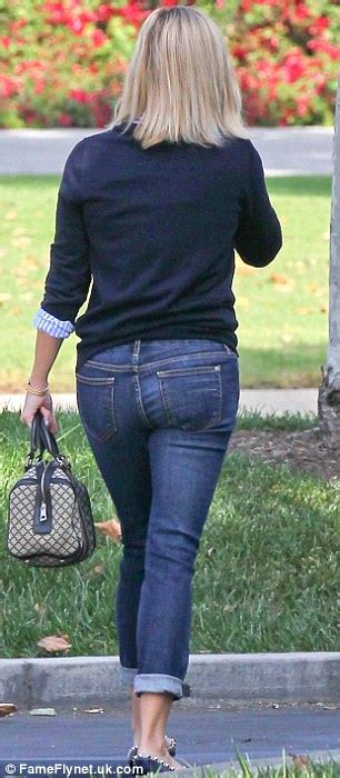 reese witherspoon shows off her slim figure as she squeezes into
