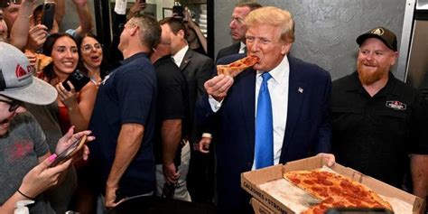 Trump Makes Surprise Visit To Florida Pizza Place Hands Out Slices To