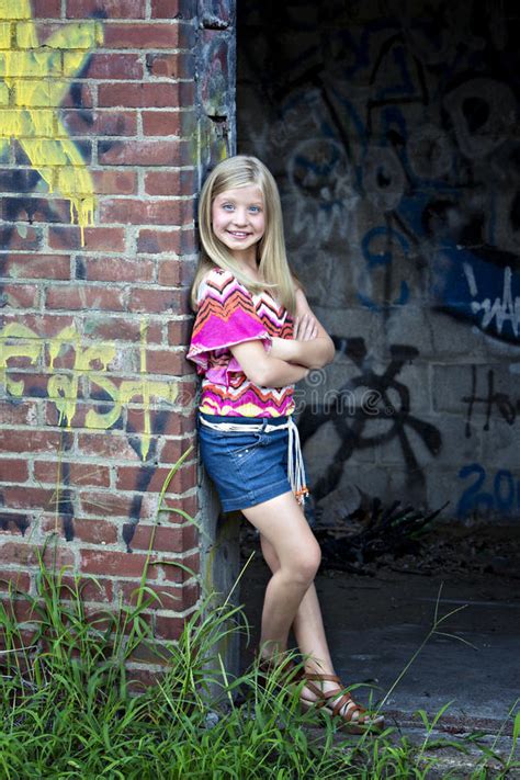 cute little blonde girl at graffiti wall stock images image 25854204