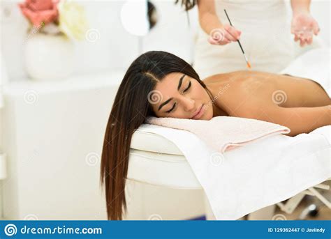 arab woman in wellness beauty spa having aroma therapy massage stock