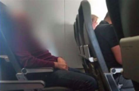 a frontier airlines passenger was caught urinating on the seat in front