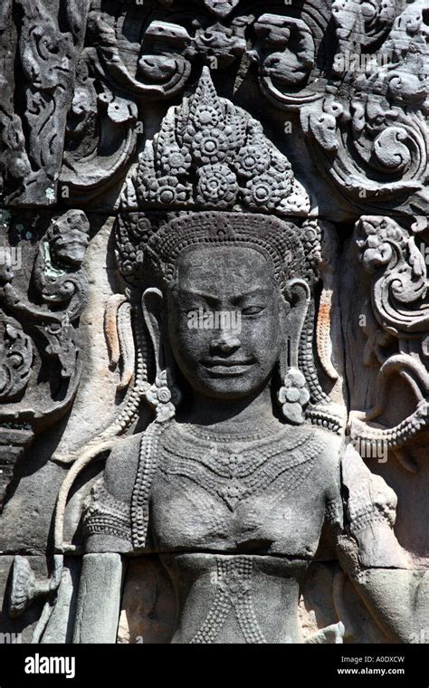 A Stone Carving Of An Apsara Dancing Girl At Bayon Temple In Cambodia