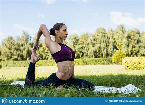 athletic woman  penguin pose practicing stock image image