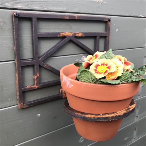 wall mounted pot holder  rustic merchant flower pot holders