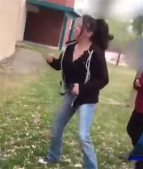 mother arrested after cheering daughter on during brutal school fight