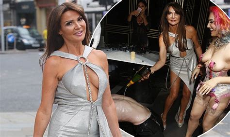 lizzie cundy shows off her curves in racy silver gown at bash daily mail online