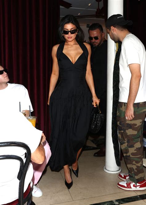 Kylie Jenner Flaunts Cleavage In Flowing Black Dress As Fans Praise