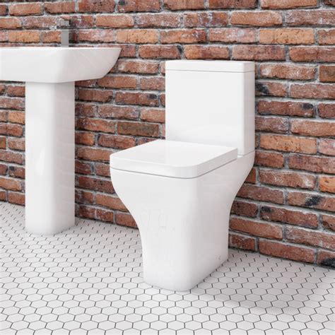 close coupled rimless comfort height toilet  soft close seat austin  bathrooms