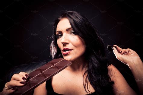 Young Woman Enjoying Chocolate Featuring Eating Portrait And Face