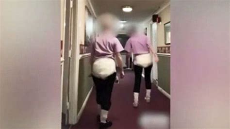 Nursing Hospital Staff Mocking Patients Wearing An Adult Diaper