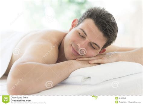 Man Resting On Massage Table At Health Spa Stock Image