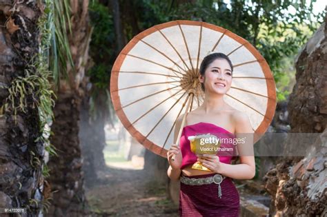 Beautiful Lao Girl In Laos Costume Holding Umbrella High Res Stock