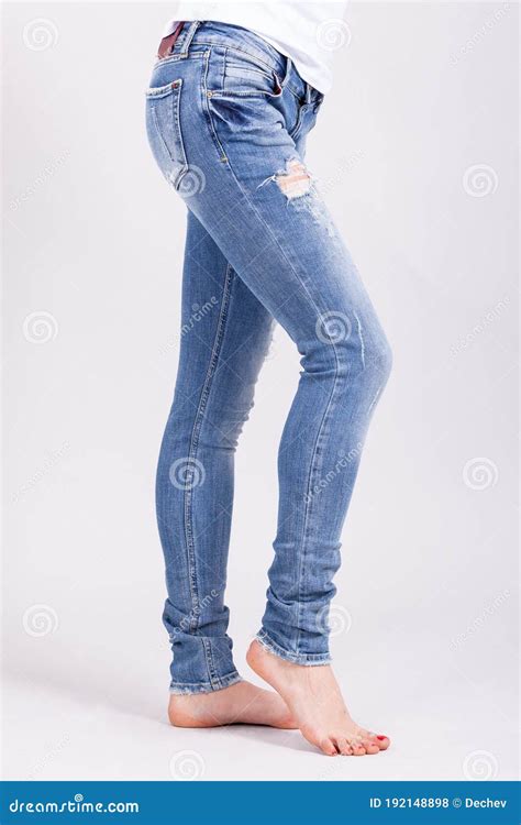 close up of woman wearing blue jeans fit female in blue jeans stock