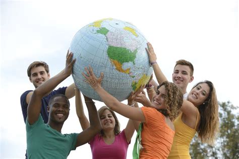 group  young people holding  globe earth stock photo image