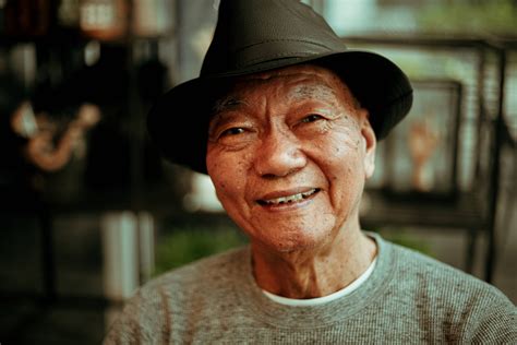 Download Old Asian Man Smile And Hat Wallpaper