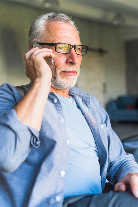 Free Photo Elderly Man Wearing Black Glasses Talking On