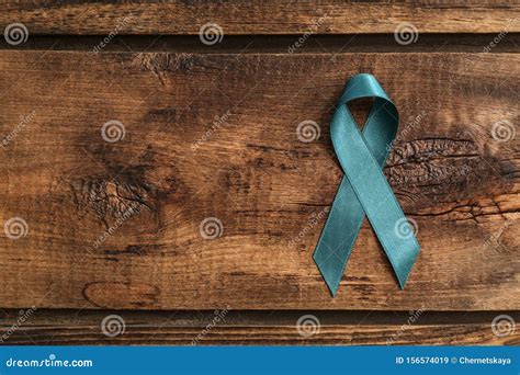 teal awareness ribbon  background top view  space  text