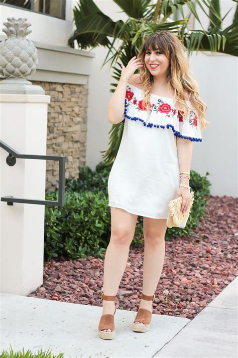 miami fashion blogger stephanie pernas wearing  white   shoulder pom pom dress  wedges